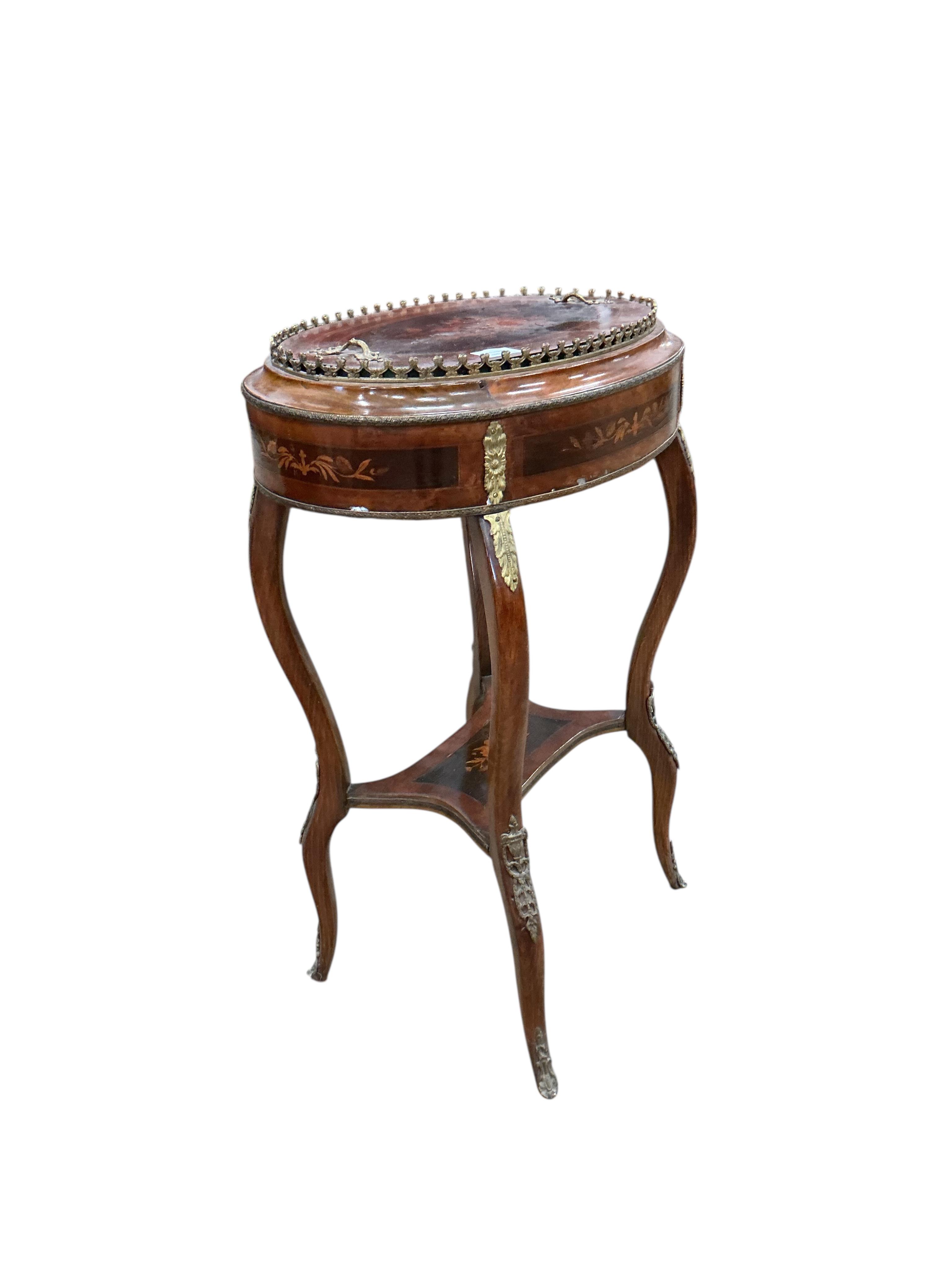 A French Louis XVI style oval gilt metal mounted marquetry inlaid walnut and beech jardiniere table, width 56cm, depth 38cm, height 80cm